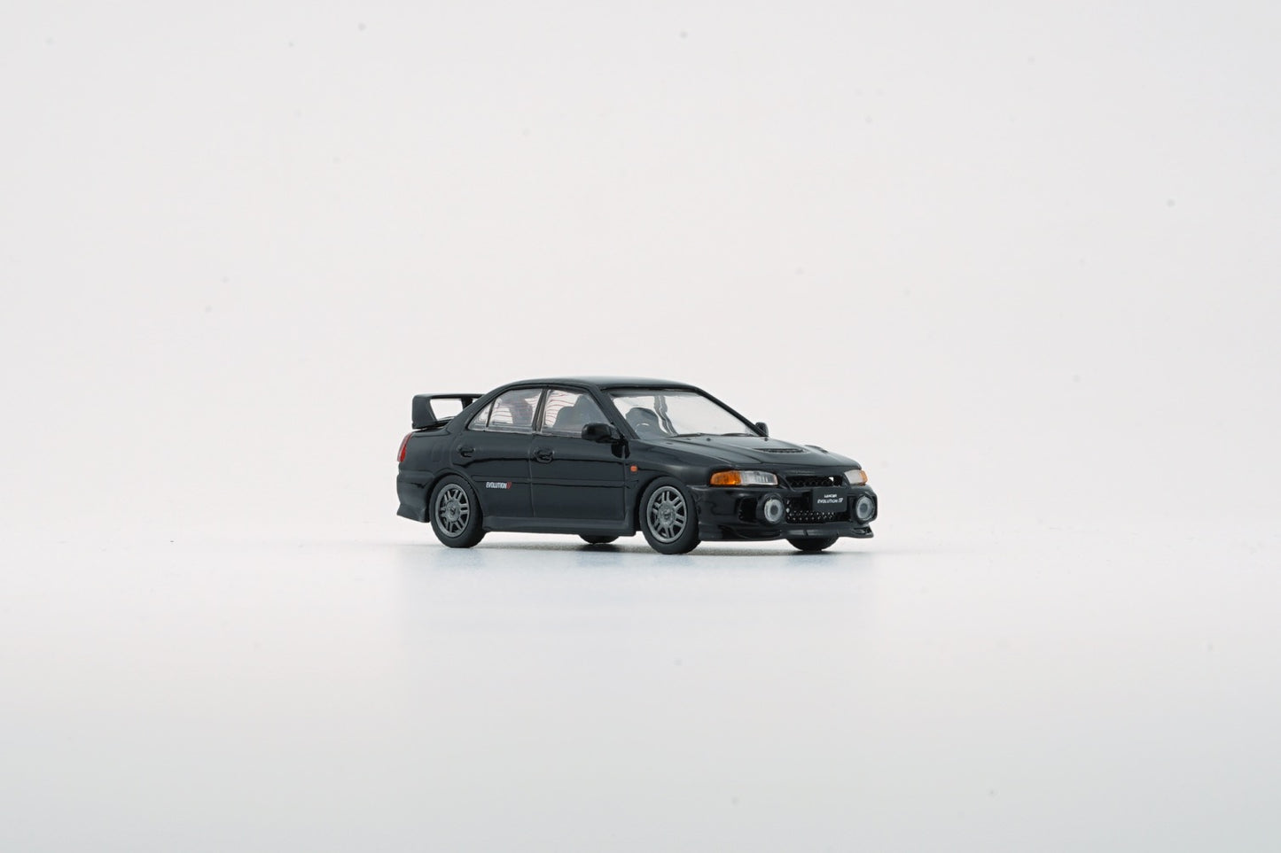 BM Creations 1/64 Mitsubishi Lancer Evolution IV & Extra Wheels (Black)